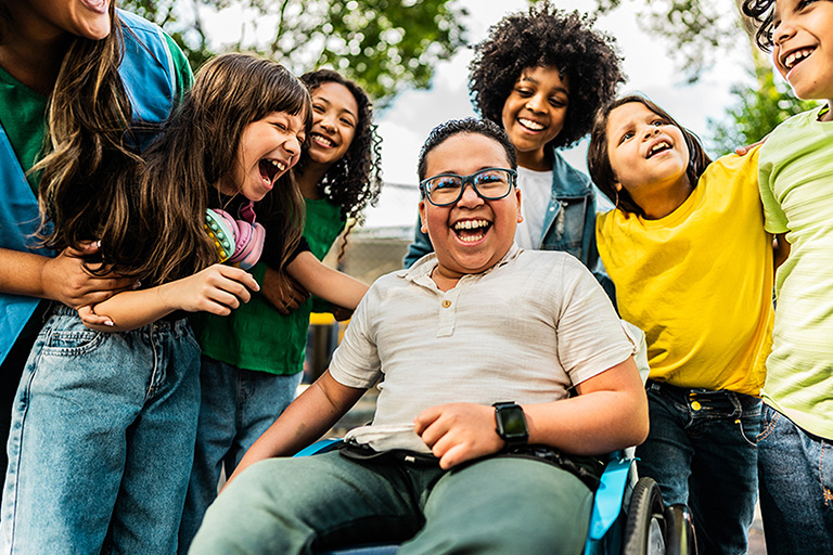 Students hanging out and laughing together outside of school. Students hanging out and laughing together outside of school.