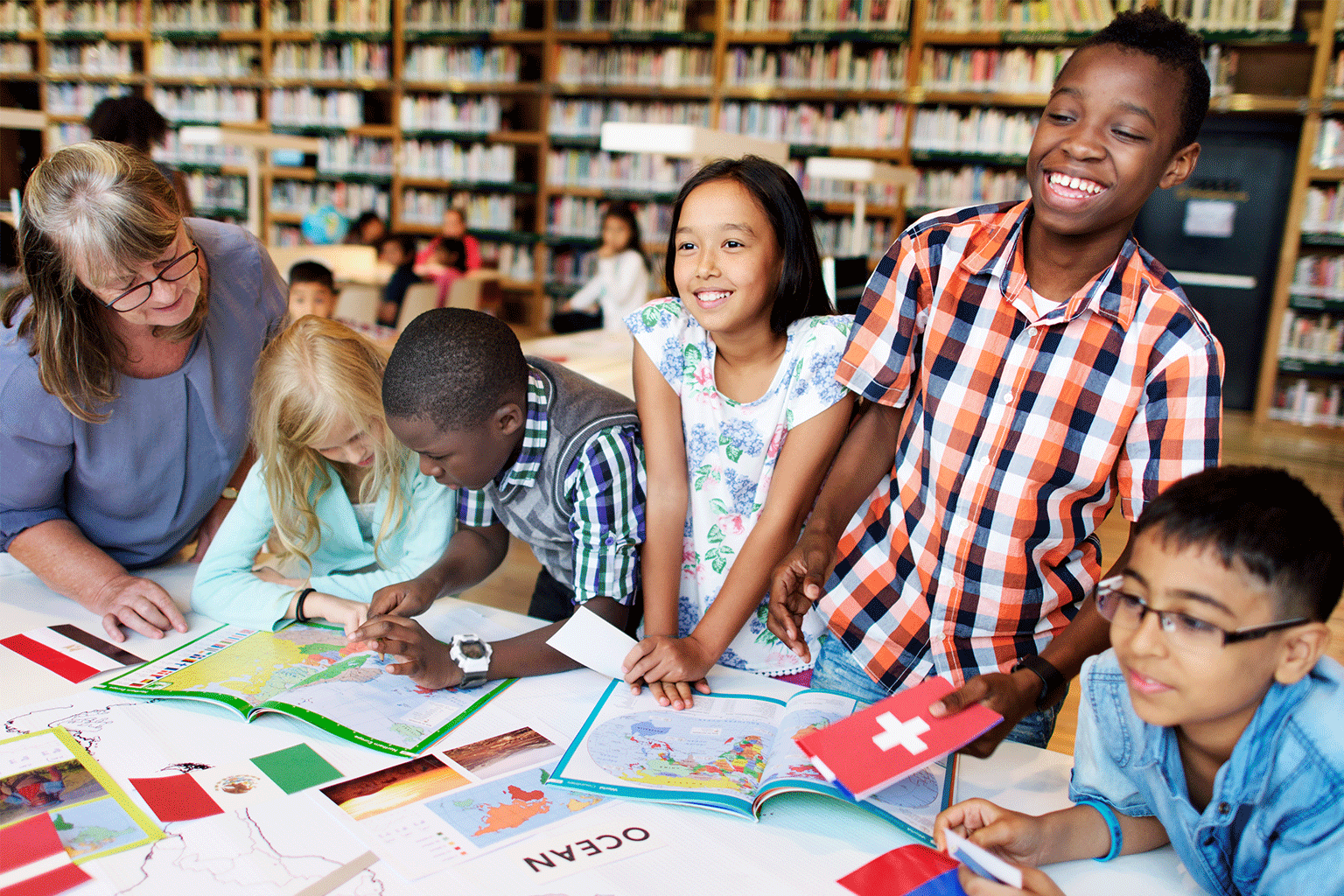Students working as a small group with a teacher.  Students working as a small group with a teacher.