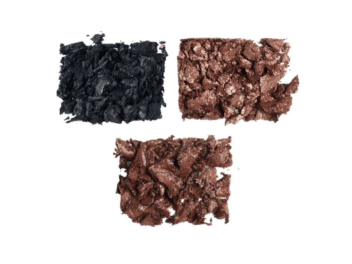 Hollywood Flawless Eye Filters Define shade swatches Swatches of three eyeshadows in grey-black, coffee brown, and bronze-brown,