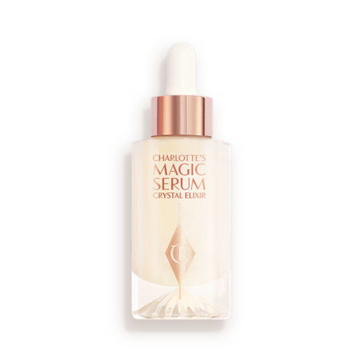 Charlotte's Magic Serum Crystal Elixir closed An award-winning, luminous, ivory-coloured serum in a glass bottle with a gold and white-coloured dropper lid.