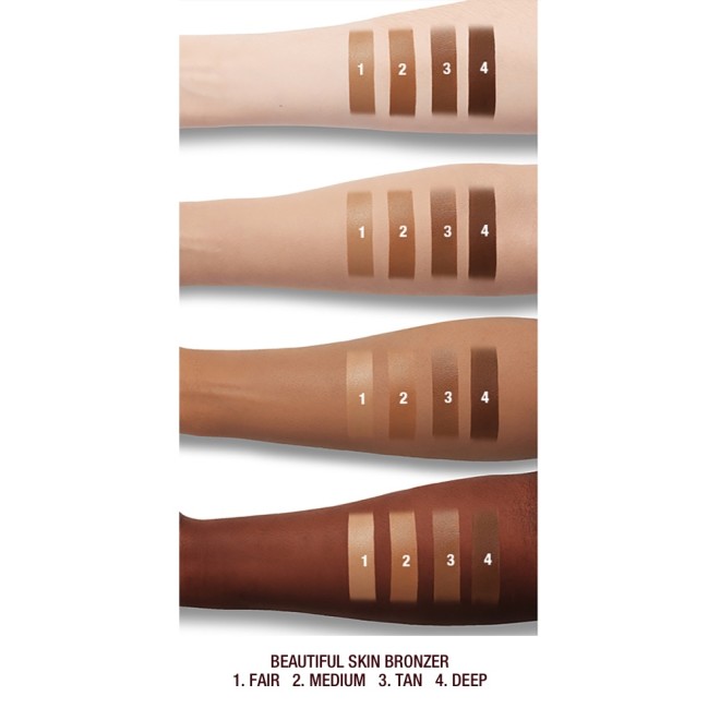 Fair, light, tan, and deep-tone arms with swatches of four cream bronzers in sandy-beige, light brown, medium-brown, and dark brown cream bronzers.