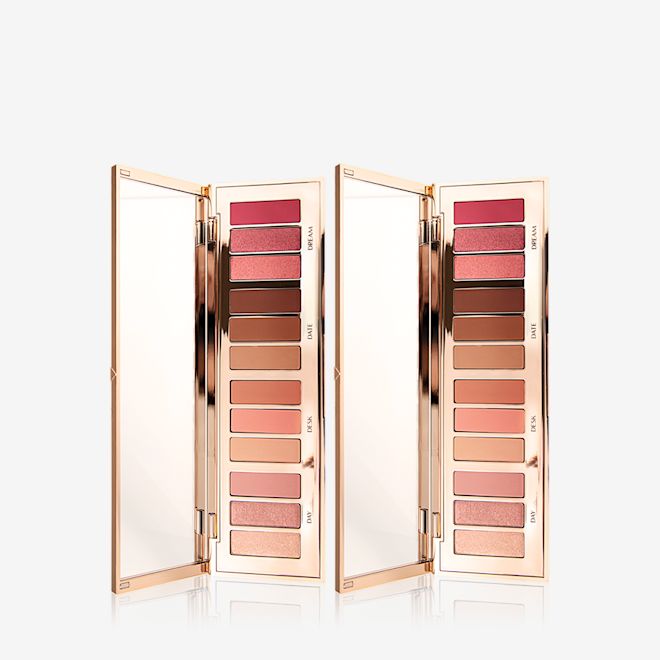 Instant Eye Palette in Pillow Talk Duo open Two open, mirrored-lid eye palettes with a rose gold, high shine finish, revealing twelve eyeshadows in shades of pink, peach, brown, and champagne.