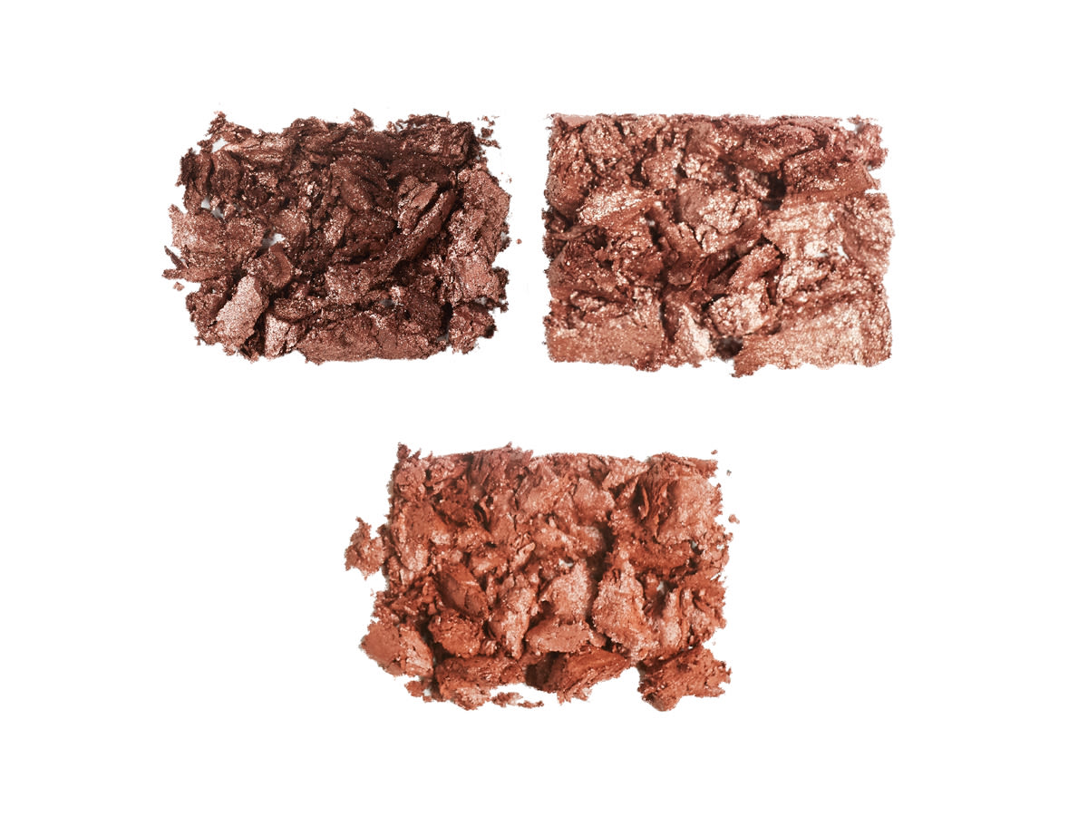 Hollywood Flawless Eye Filters Smoke shade swatches Swatches of three smokey eyeshadows in dark brown, terracotta, and bronze colours.