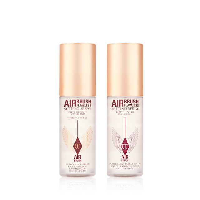 Airbrush Flawless Setting Spray Duo travel-size closed Two, identical mini, setting sprays in clear bottles with gold-coloured lids.