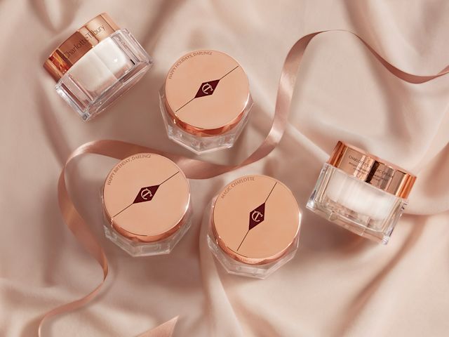Charlottes Magic Cream collection with engraved lids Collection of thick, pearly-white creams in glass jars with gold-coloured engraved lids.