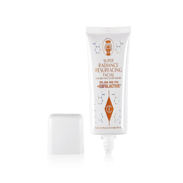 Super Radiance Resurfacing Facial open An open, exfoliating, wash-off, chemical mask in a white-coloured tube with gold-coloured text on it with its white-coloured lid next to it.