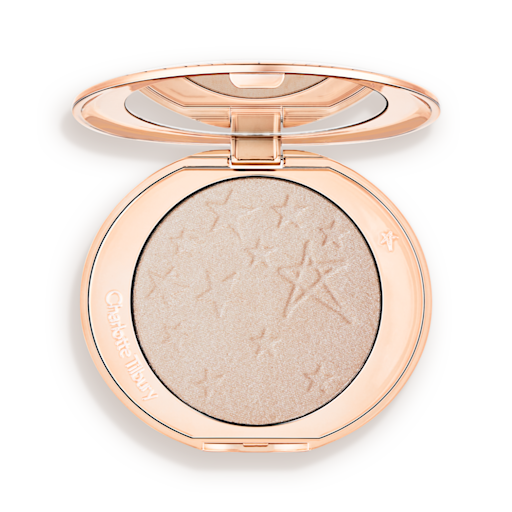 Hollywood Highlighter in Moonlit Glow open An open highlighter powder compact with a mirrored lid, in a shimmery silvery-opal shade.