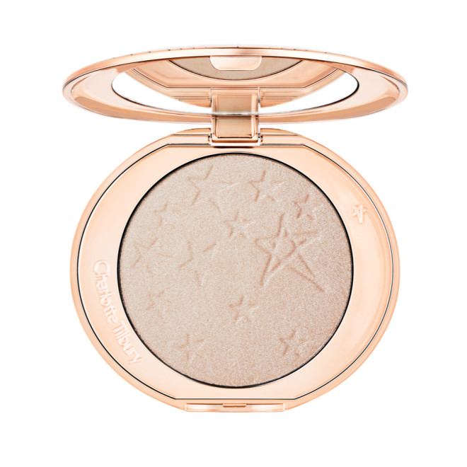 An open highlighter powder compact with a mirrored lid, in a shimmery silvery-opal shade. 