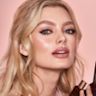 Quick & Easy Instant 5 Minute Date Night Look on fair-tone model Fair-tone model with blue eyes wearing shimmery pink eyeshadow with nude pink blush and lip stain, and dewy opal-coloured highlighter for a fresh, date-night makeup look.
