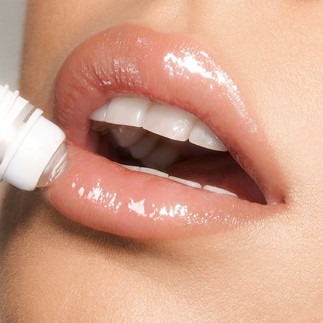 Magic Lip Oil application Lip close up applying Charlotte's Magic Lip Oil Crystal Elixir