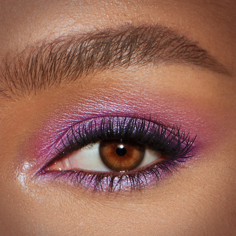 Duochrome Violet Eyeshadow Look Model eye close up wearing a duochrome violet eyeshadow makeup look using Pillow Talk Ultraviolet Hypnotising Pop Shot