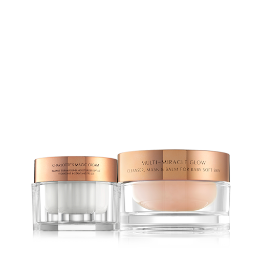 Multi Magic Glowing Skin Kit closed Pearly-white face cream in a glass jar with a gold-coloured lid and three-in-one cleansing balm with a gold-coloured lid.