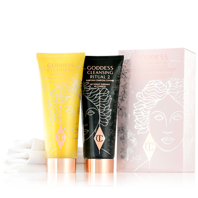 Goddess Cleansing Ritual Cleanser 1 & 2 Two facial cleansers, one in lemon-yellow packaging and the other in charcoal-black, with rose-gold coloured lids.