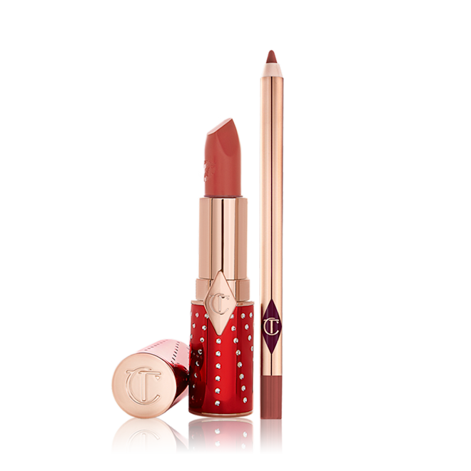 Lucky New Year Lip Kit open An open lipstick in red and gold packaging in a dark brown-peach shade with an open lip liner pencil in a matching colour.