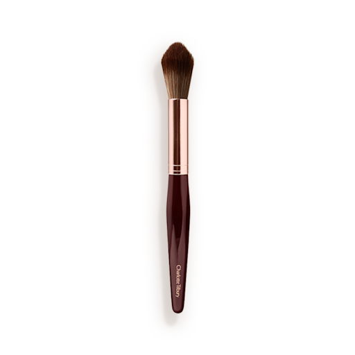 Synthetic Powder and Sculpt Brush A powder brush with soft bristles and the handle in a dark crimson and rose-gold colour scheme.