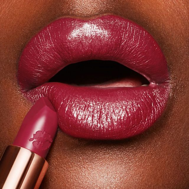 Amazing Amal lip close up Dark-haired model wearing Amazing Amal berry-pink lipstick
