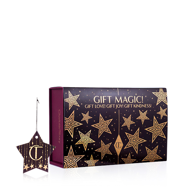 Gift Magic gift box Plum and dark-brown-coloured banner with gold stars printed all over it along with the text, 'Gift magic!'