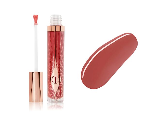 Collagen Lip Bath in Walk of No Shame open with swatch A lip gloss in a berry-rose shade with its heart-shaped applicator next to it along with its swatch.