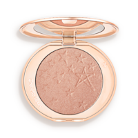 Hollywood Highlighter in Pillow Talk Glow open An open highlighter powder compact with a mirrored lid, in a shimmery rose gold shade.