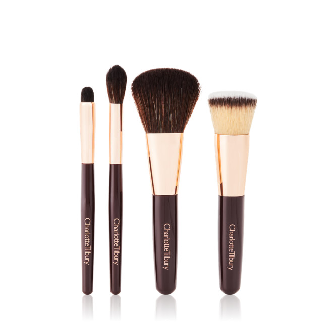A foundation brush, powder brush, an eyeshadow brush, and a bronzing brush. 