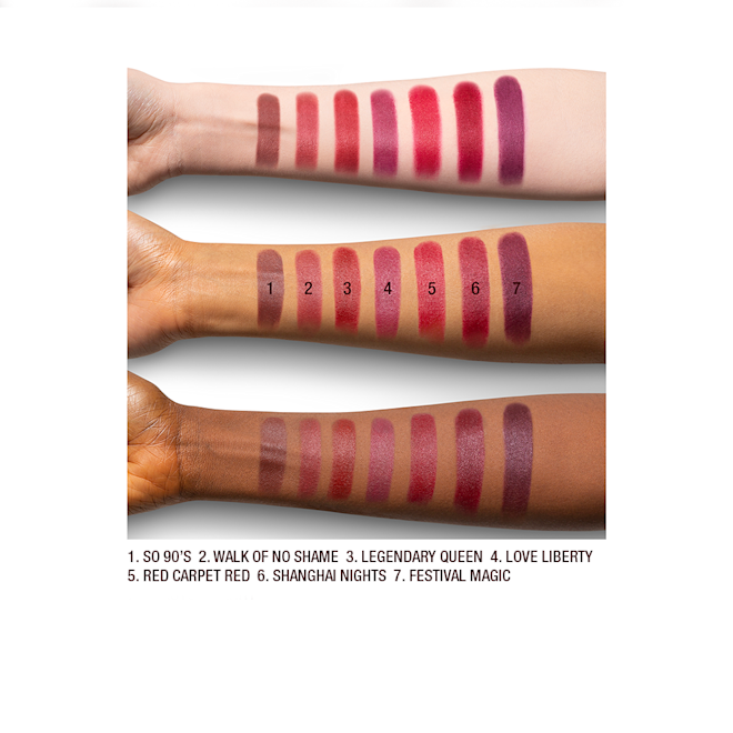Iconic Matte Revolution Red shades arm swatches Fair, tan, and deep-tone arms with seven matte lipsticks in shades of magenta, fuchsia, ruby red, pink-red, brown-red, orange-red, and purple-red.