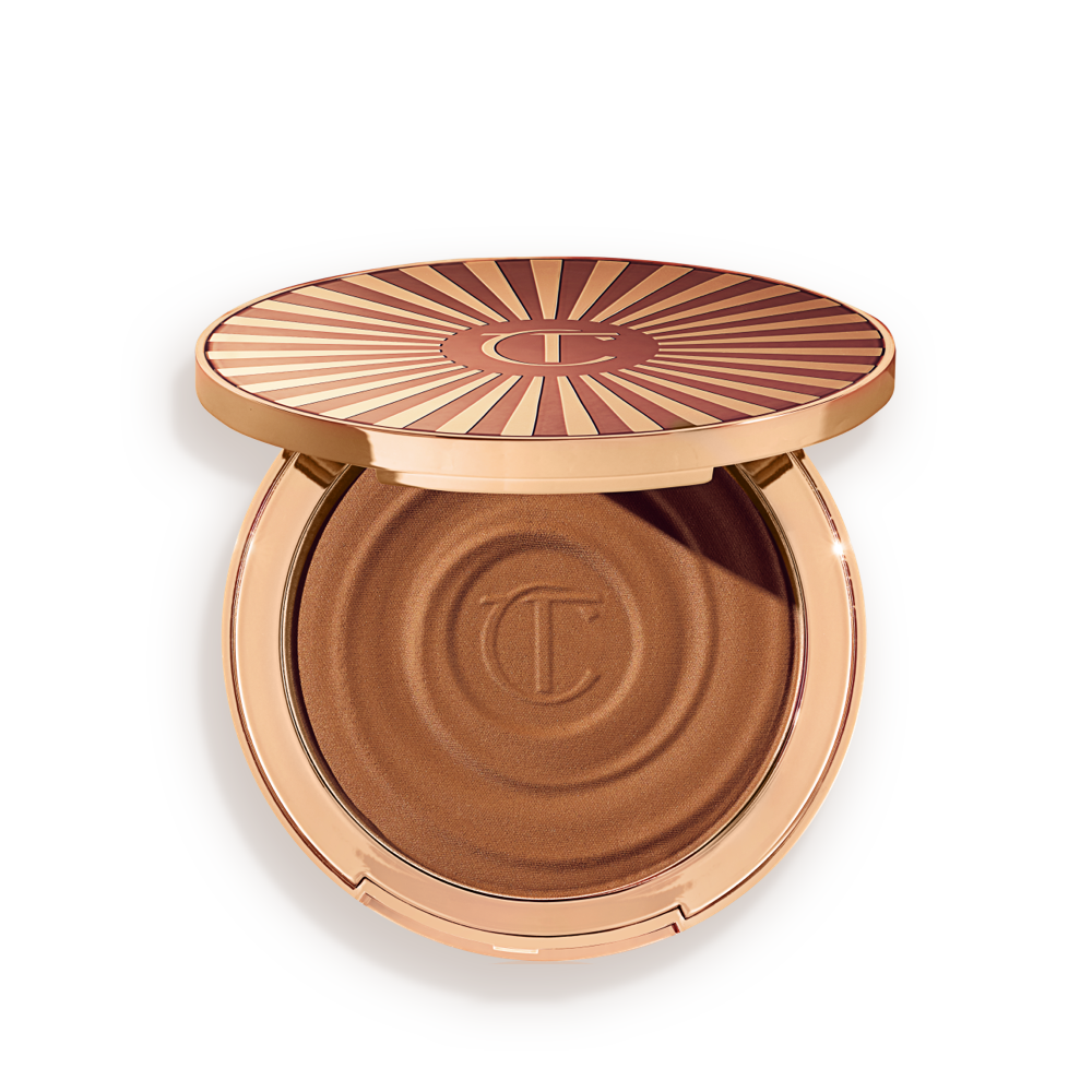 Beautiful Skin Sun-Kissed Glow Bronzer in Medium open Open, cream bronzer compact in a medium-brown shade with gold-coloured packaging.
