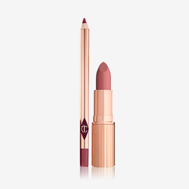 Blushing Dream Luscious Lip Slick open An open lip liner pencil in a purplish red shade with an open lipstick in a pinkish coral shade.