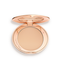 Airbrush Flawless Finish in Medium open An open, pressed powder compact in a light beige shade.