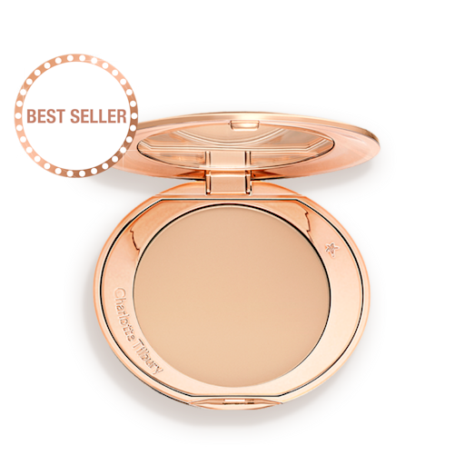 airbrush-flawless-medium-packshot An open, pressed powder compact in a light beige shade.