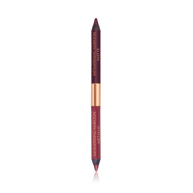 A double-ended eyeliner with lids removed with one side a bright maroon and the other a rich violet.