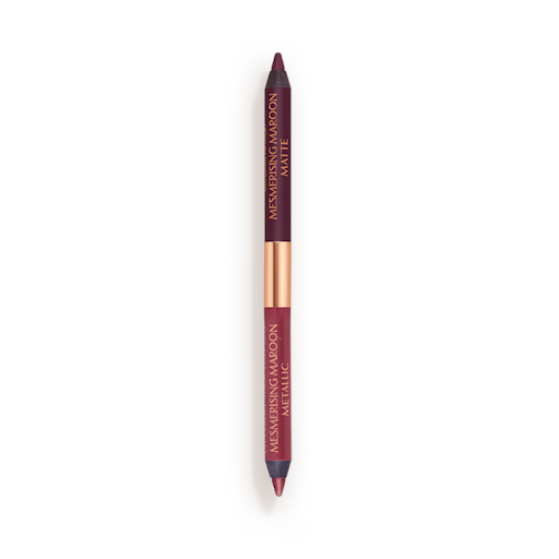 Eye Colour Magic Liner Duo in Mesmerising Maroon open packshot A double-ended eyeliner with lids removed with one side a bright maroon and the other a rich violet.