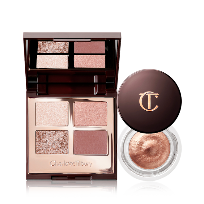 The Dreamy Eye Kit open An open, mirrored-lid, quad eyeshadow palette in shimmery and matte nude shades with an open cream eyeshadow in rose gold colour with its lid next to it.