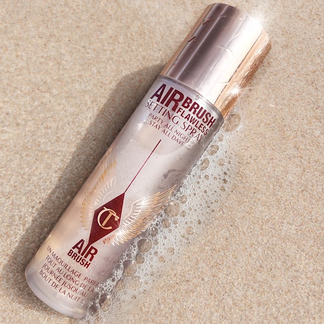 Airbrush Flawless Setting Spray closed A closed setting spray in a clear bottle with a gold-coloured lid.