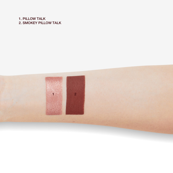 Fair-tone arm with swatches of eyeshadow pencils in rose gold and smokey berry-pink.