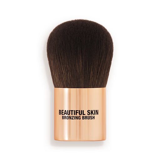 Beautiful Skin Bronzer brush A bronzer brush with soft, dark brown synthetic bristles and a golden-coloured handle, perfect for both cream and powder bronzers.