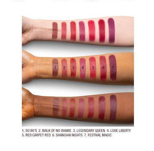 Matte Revolution red lipstick arm swatches Arm swatches on fair, medium, and dark tone models of matte lipsticks in shades of red, plum, and burgundy.