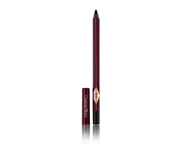 Rock N Kohl in Bedroom Black open An open, black-coloured kohl eyeliner pencil in dark crimson and golden-coloured packaging with its lid next to it.