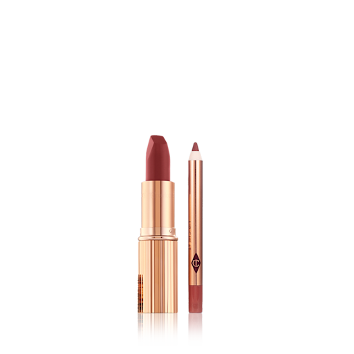 Walk of No Shame Lip Kit open A berry-red lip liner pencil with an open matte lipstick in a berry-rose shade inside a golden-coloured tube.