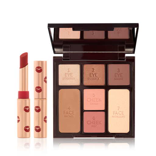 Instant Summer Kit open Pigmented, red lipstick with a matte finish in a gold-coloured tube with lipstick kiss prints all over accompanied with a refill, and an open, face palette with a mirrored-lid with three rose gold, dusky pink, and plum-coloured eyeshadows, two blushes in soft peach and medium-pink, light brown bronzer, and soft, gold-coloured highlighter.