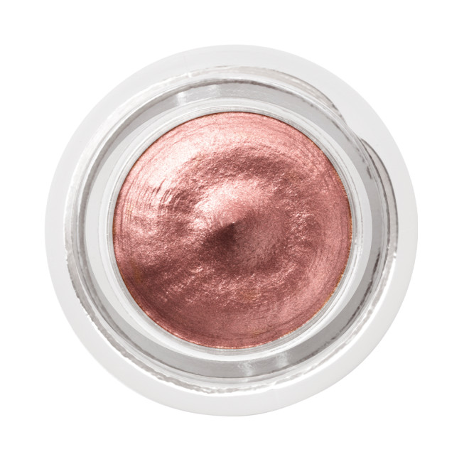 Cream eyeshadow in an open glass pot in a nude pink shade with fine shimmer.