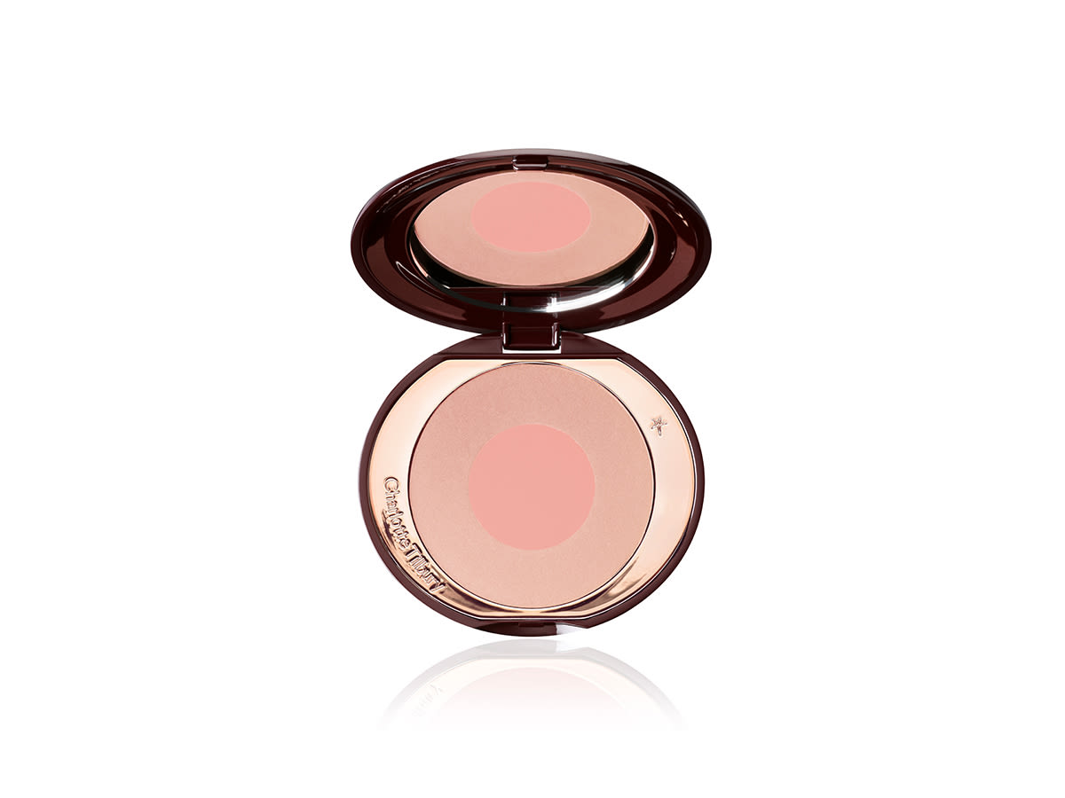 Cheek To Chic in First Love An open, mirrored-lid, two-tone powder blush in rose gold and pink.