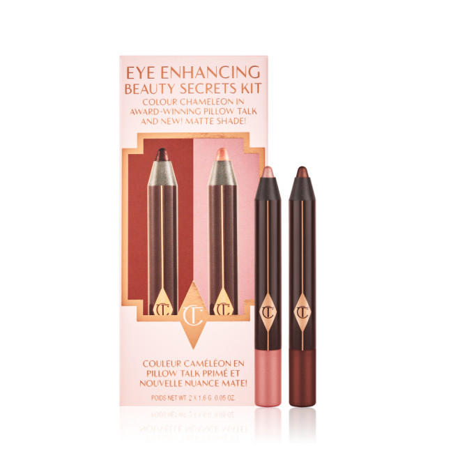 Chubby eyeshadow pencils in rose gold and smokey berry-pink in a pink-coloured gift and packaging box. 