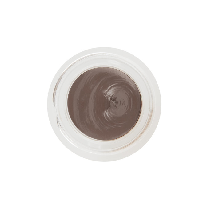 An open frosted glass pot with a cream eyeshadow in a smokey taupe shade with a matte finish.