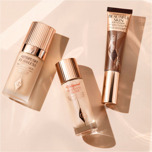 Charlotte's foundations still life Airbrush Flawless Foundation, Hollywood Flawless Filter and Charlotte's Beautiful Skin Foundation lined up