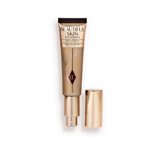 Beautiful Skin Foundation in Shade 7N open An open foundation wand in gold packaging with a pump dispenser and a medium-brown-coloured body to show the shade of the foundation inside.
