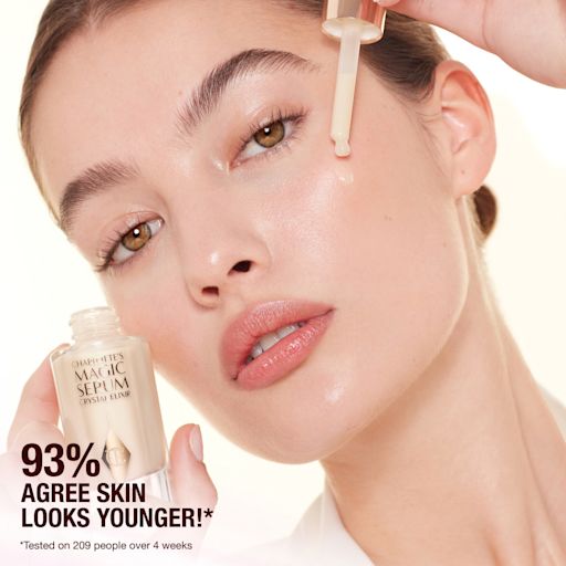 Model applying Charlottes Magic Crystal Elixir Model applying Charlottes Magic Crystal Elixir