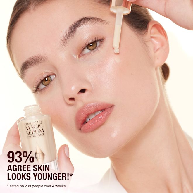 Model applying Charlottes Magic Crystal Elixir Model applying Charlottes Magic Crystal Elixir