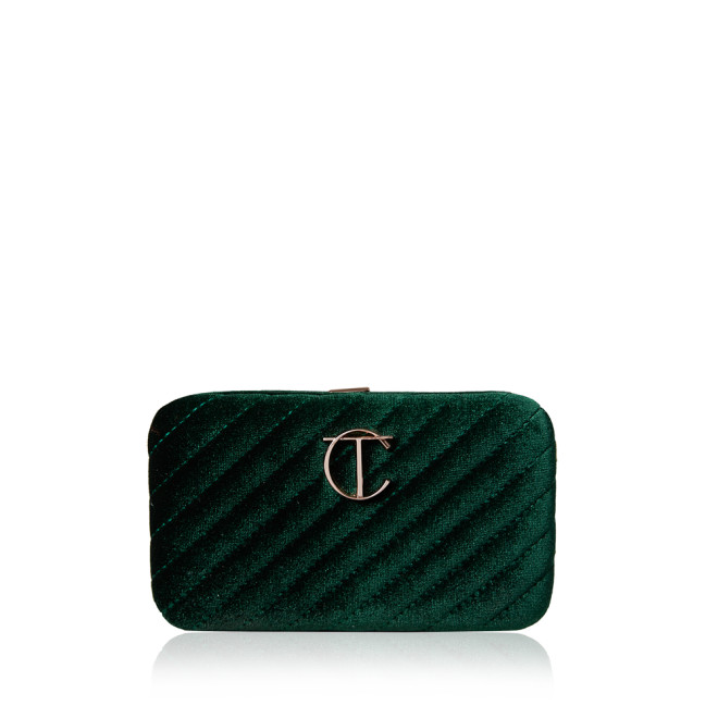 A closed makeup bag in a bottle green colour with the CT logo in the middle in golden. 