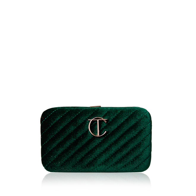 Charlotte's Hollywood Mini Brush Set closed A closed makeup bag in a bottle green colour with the CT logo in the middle in golden.