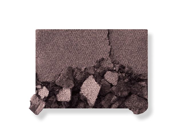 Luxury Palette The Uptown Girl Smoke shade swatch Swatch of a powder eyeshadow in a smokey silver-grey shade.